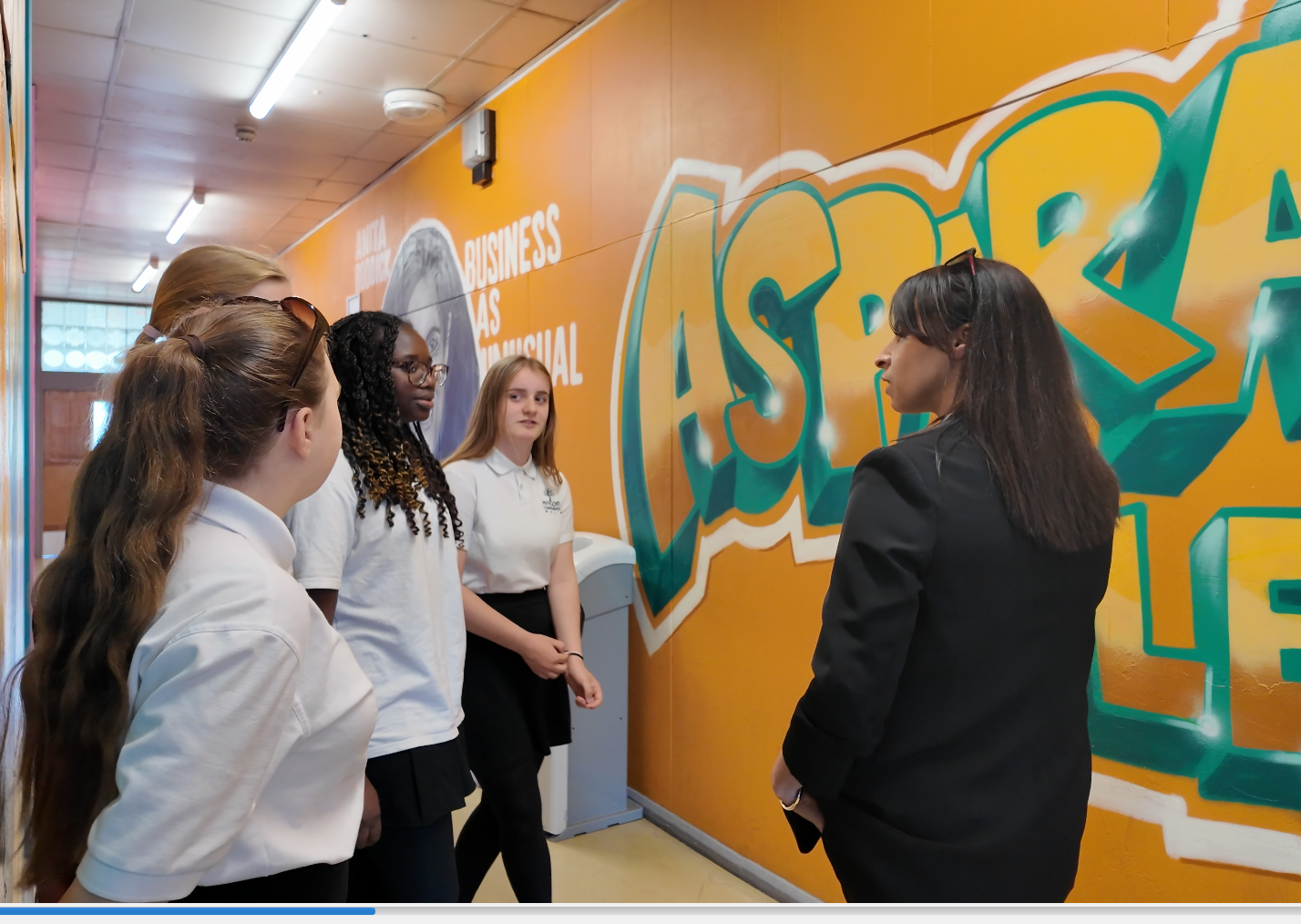 Commissioner Emma Wools speaking with pupils