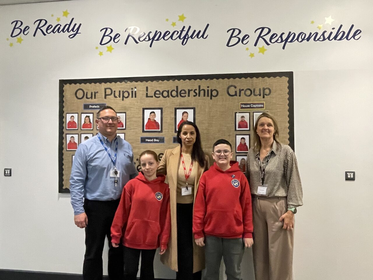 Police & Crime Commissioner, Emma Wools with pupils and Headteacher in a Primary School